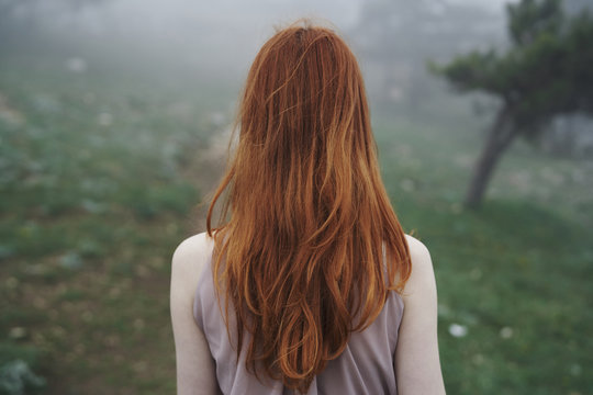 Rear view of woman with red hair