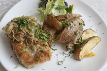 Fish served with passionated onion