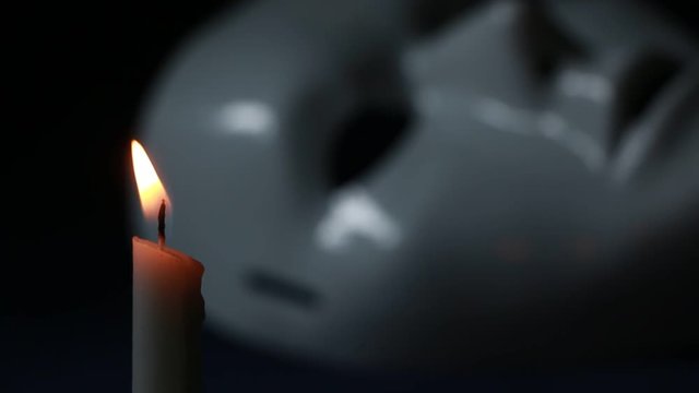 Close up of a white mystique mask 
