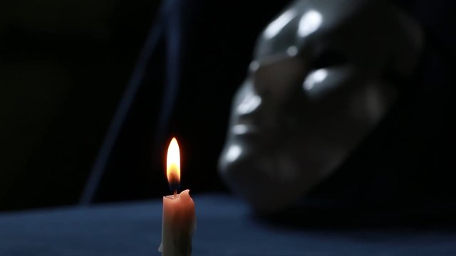 Close up of a white mystique mask 
