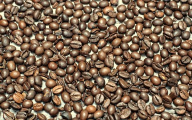 Background of brown coffee beans.Coffee beans on a wooden background.