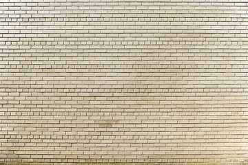 Old beige brick wall background texture