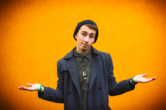 Closeup portrait of dumb, clueless young man, student, worker arms out asking what's the problem - Powered by Adobe