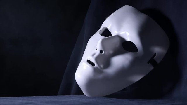 Close up of a white mystique mask 
