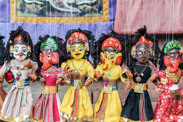 colorful Nepalese string puppets souvenir at market 