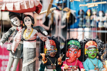 colorful Nepalese string puppets souvenir at market 