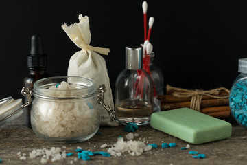 Bathroom accessories soap oils sea salt lavender aroma sachet on wooden desk toned selective focus
