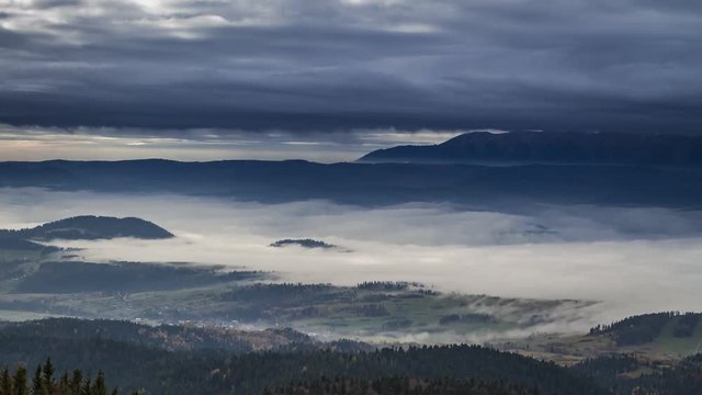 Stunning sunrise in the Tatra mountains with flowing clouds, Poland, Timelapse