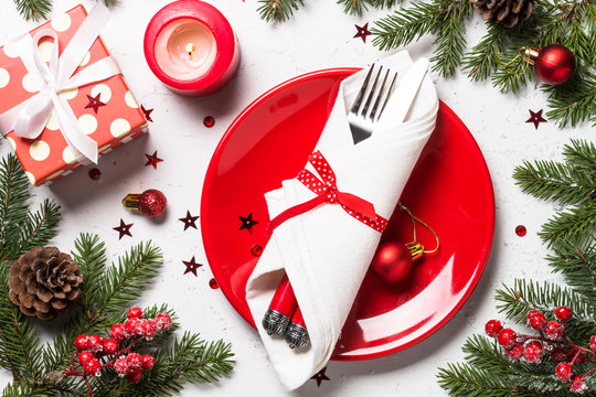 Christmas table setting on white background.