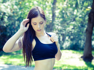 Beautiful confident young woman doing fitness exercise