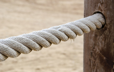 Rope fencing on the embankment of the Mediterranean Sea. Abstract background.