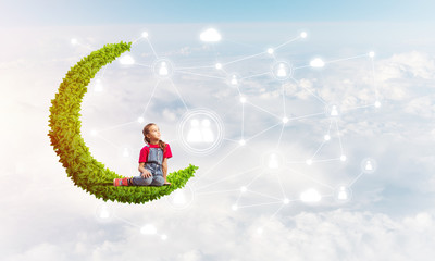 Concept of careless happy childhood with girl dreaming about something