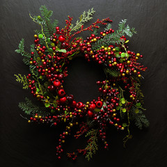 Christmas tree banches and red berries background