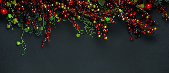 Christmas tree banches and red berries background