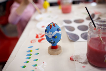 Process painting wooden Easter eggs