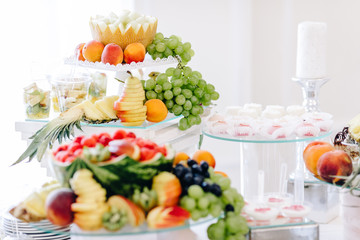 many different fruits an the wedding reception.
