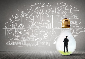 Businessman trapped in bulb