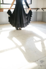 Flamenco dancer practicing indoors.