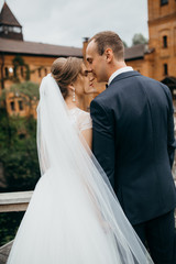 Bride and groom in the castle on the wedding 