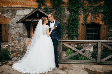 Fototapeta premium Bride and groom in the castle on the wedding 