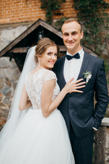 Fototapeta premium Bride and groom in the castle on the wedding 