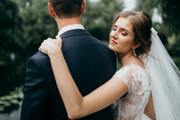 Naklejka premium Wedding couple are walking in the beautiful castle 