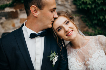 Young bride and groom in the castle in the summer