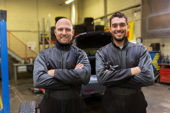 auto mechanics or tire changers at car shop