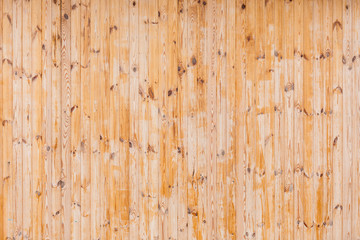 Naklejka premium wooden wall of new planks nailed vertically