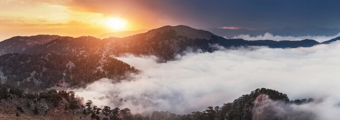 Majestic sunset in the mountains with fog and mist landscape, Turkey, Lycian Way near Tahtali peak