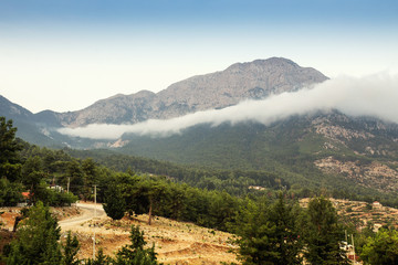 Tahtali mountain with fog, shot from beycik village in Turkey