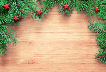 Naklejka na ściany i meble Christmas wooden background. Pine and star.