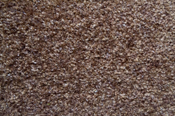 Brown carpet texture macro or closeup.