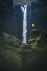 Human against waterfall