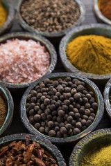 Spices and herbs in wooden bowls. Food and cuisine ingredients