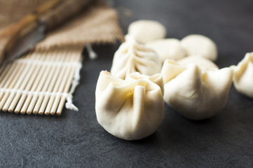 preparing of typical Mongolian meal: Buuz (Steamed Mongolian Dumplings) 