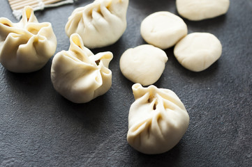 preparing of typical Mongolian meal: Buuz (Steamed Mongolian Dumplings) 