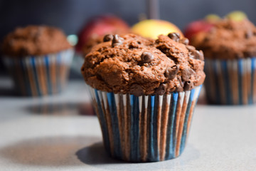 chocolate muffins, homemade cakes in the winter evening