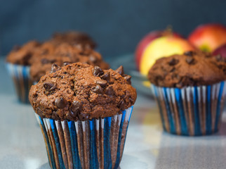 chocolate muffins, homemade cakes in the winter evening