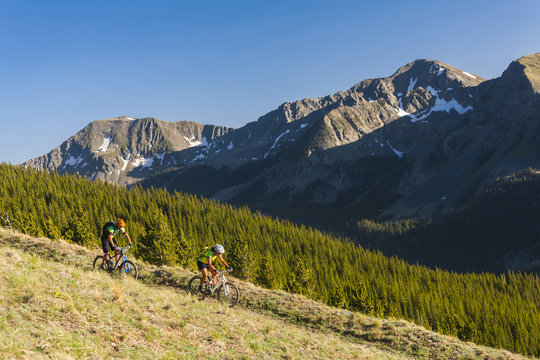 Caucasian couple mountain biking