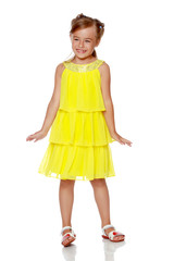 Fashionable little girl in a dress