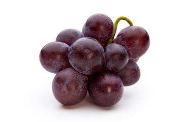 Ripe red grape isolated on white.