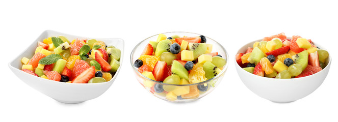 Bowls with fruit salads on white background