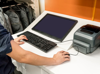 Hands of asian woman using desktop computer and mouse for business