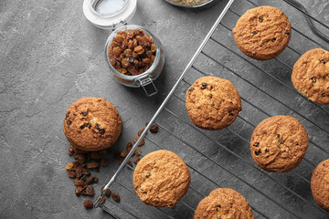 Delicious oatmeal cookies with raisins on metal grid