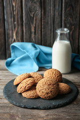 Delicious oatmeal cookies on slate plate
