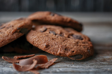 Delicious oatmeal cookies with chocolate chips on table, close up