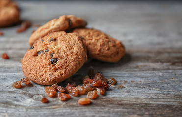 Delicious oatmeal cookies with raisins on table, close up