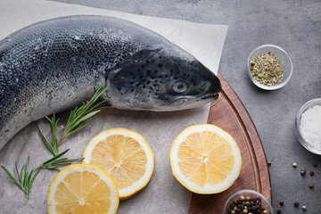 Board with fresh raw salmon on table, closeup