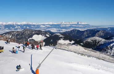 Skiers on a sunny day on Mount Chopok in the resort of Jasna.